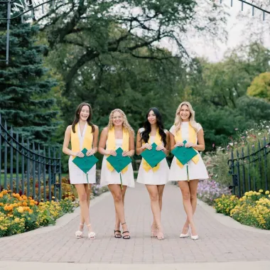 group of graduates in front of the NDSU gate