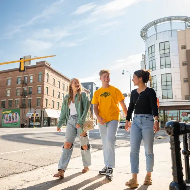 NDSU students visit while they walk in downtown Fargo