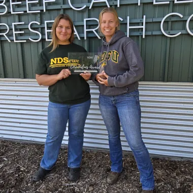 Co-workers show their award.
