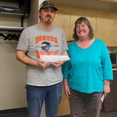 Co-worker receives an award.