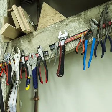 Woodshop tools lined up on magnetic strip.