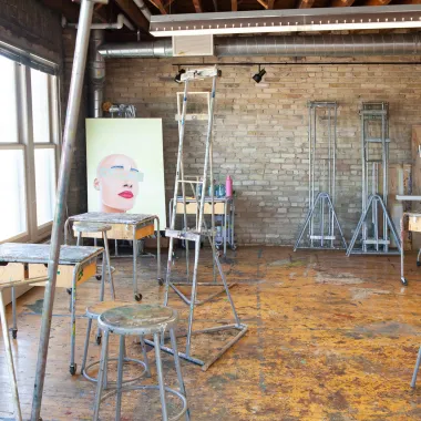 Stools, easels and canvas in painting studio.