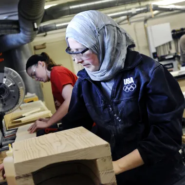 Woodshop student working with wood in class.
