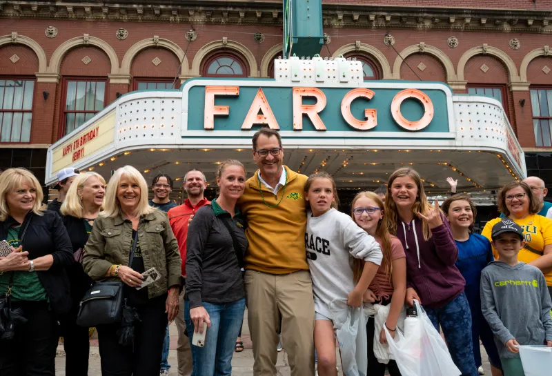 President Cook with parade crowd