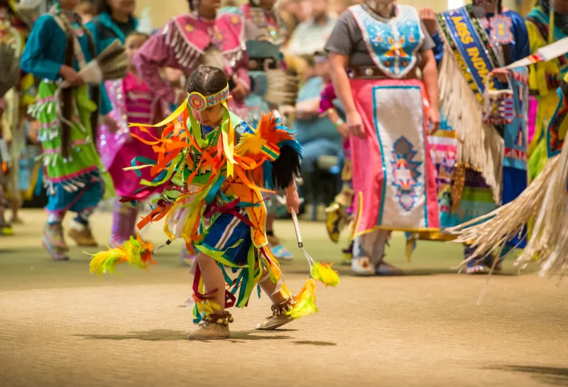 young Native American dancing at pow wow