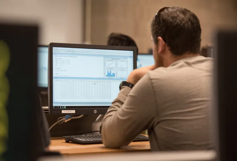 student viewing a statistics program on a monitor