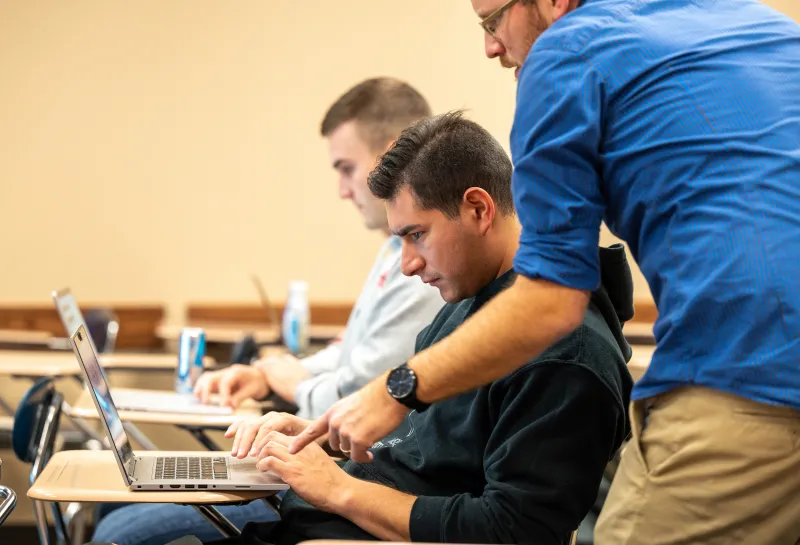 professor helping a student in class