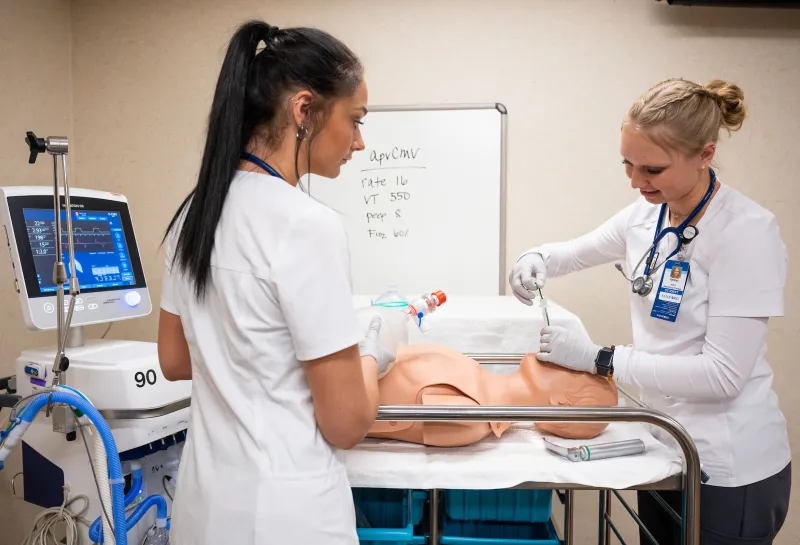 Respiratory Care students practicing procedures on a mannequin