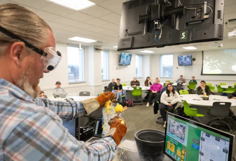 professor performing an experiment in class