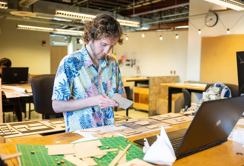 student working on a project in a design lab