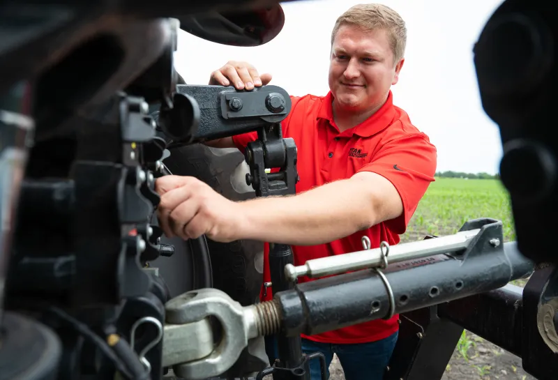 student working on a piece of machinery