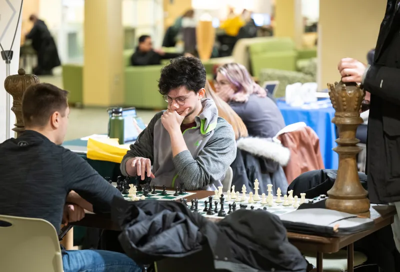 students playing chess at the Student Activities Fair