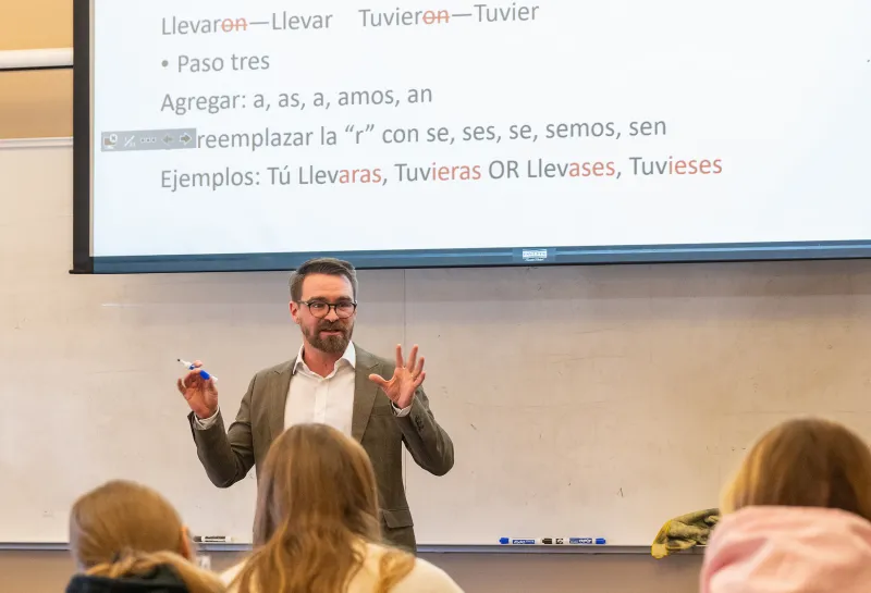 professor lecturing to students during Spanish class