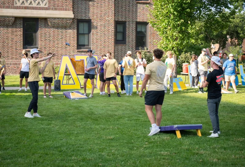 students playing cornhole during a Welcome Week event
