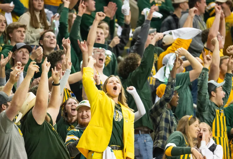 football crowd cheering with an NDSU cheer leader