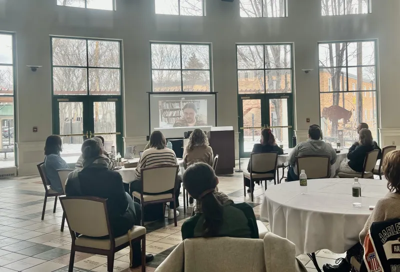 Students sitting listening to speaker.