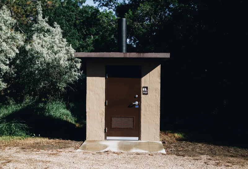 Port-a-potty in a forest
