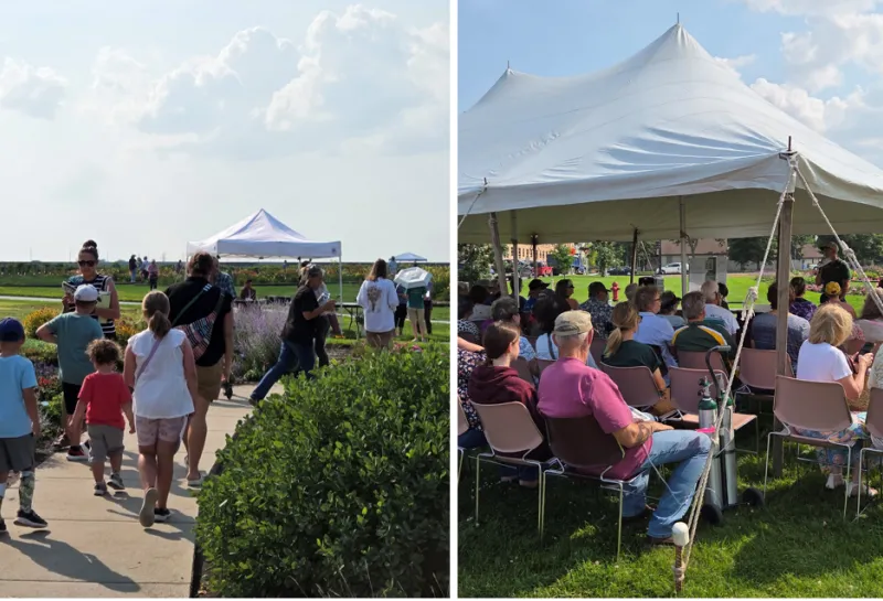 people gather under tents