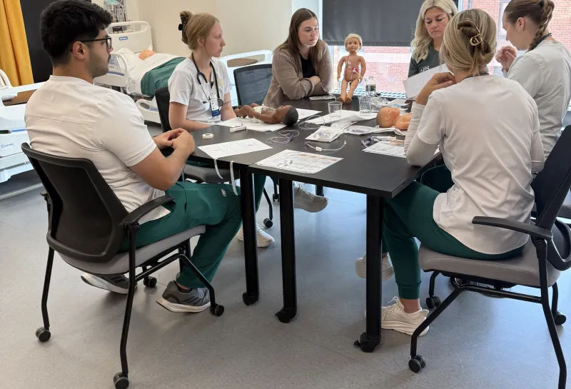 Nursing students discussing project