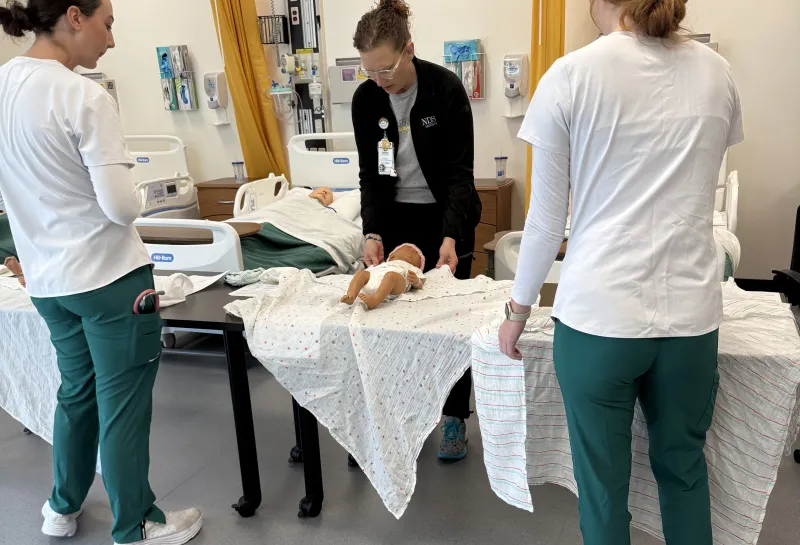 Nursing students demonstrating for faculty