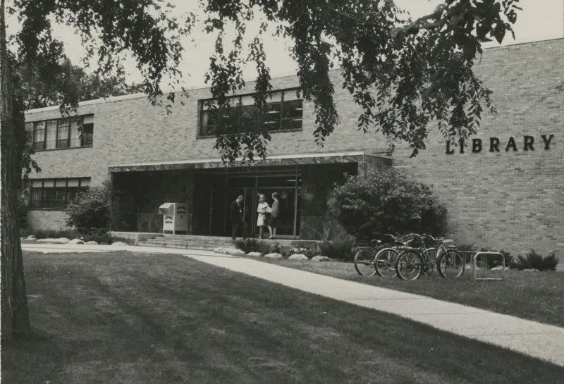 A student stands in front of NDSU's Main Library in 1950.