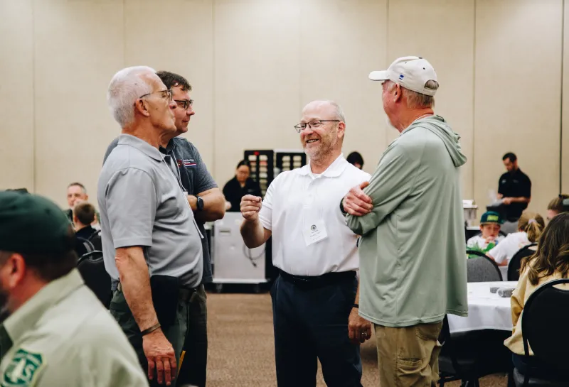 A group of men share a laugh