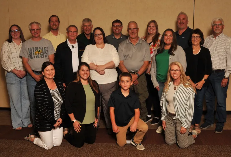 A group of people smiling