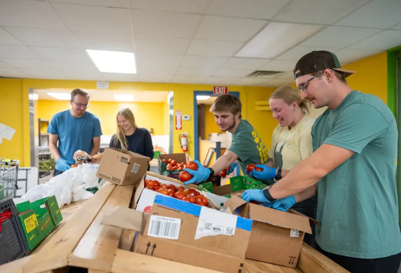 student volunteering as part of Serve with the Herd during Homecoming 2025 week