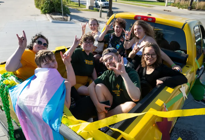 students giving Bison horns from their parade float during Homecoming 2025