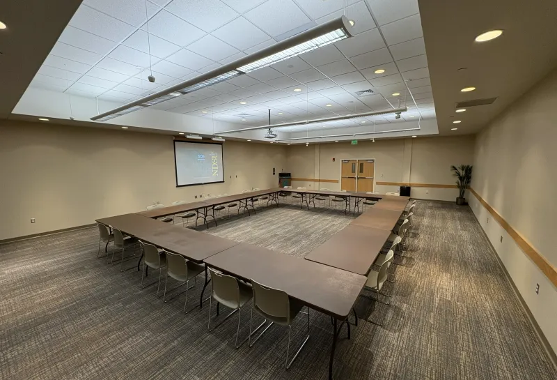 Sahnish room with open square table arrangement