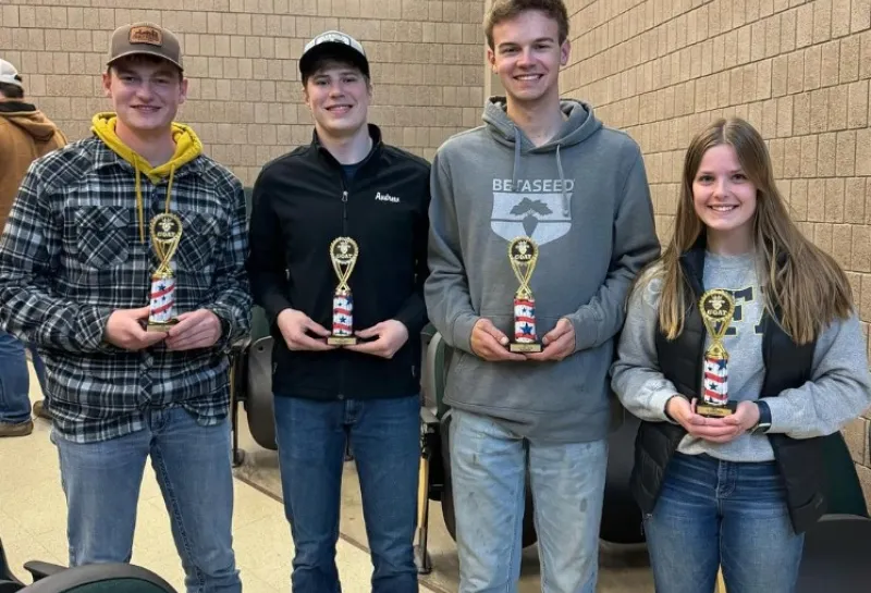 agronomy club students posing with trophies