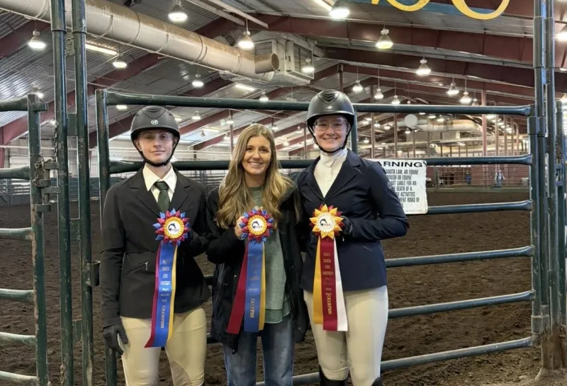 NDSU equine team posing with place ribbons
