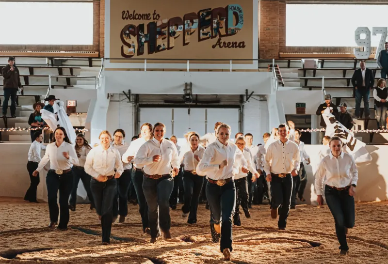 NDSU Little I crew running in Sheppard Arena