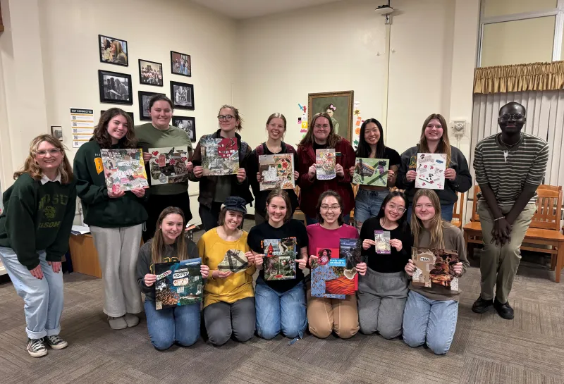 Group of students posting with vision boards