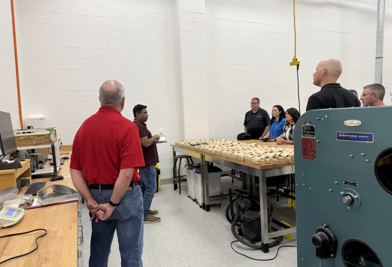 Bay state team in our grain processing room looking at samples