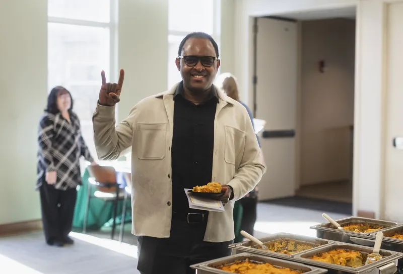 Honoree getting food at Beta Gamma Sigma