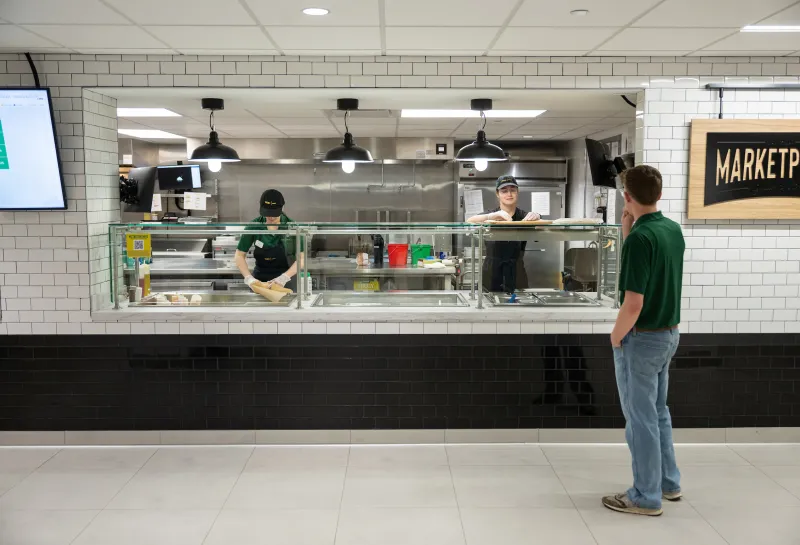 two students working in the union market