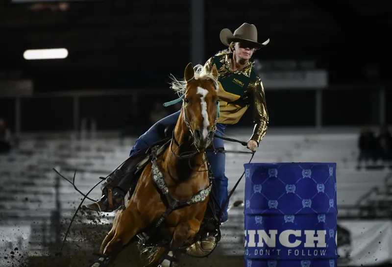 NDSU Alumni Megan Larson Riding Horse During Barrel Racing at Rodeo