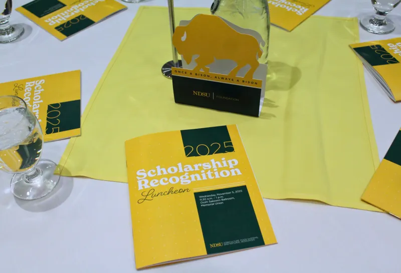 Scholarship Recognition Luncheon program book on table