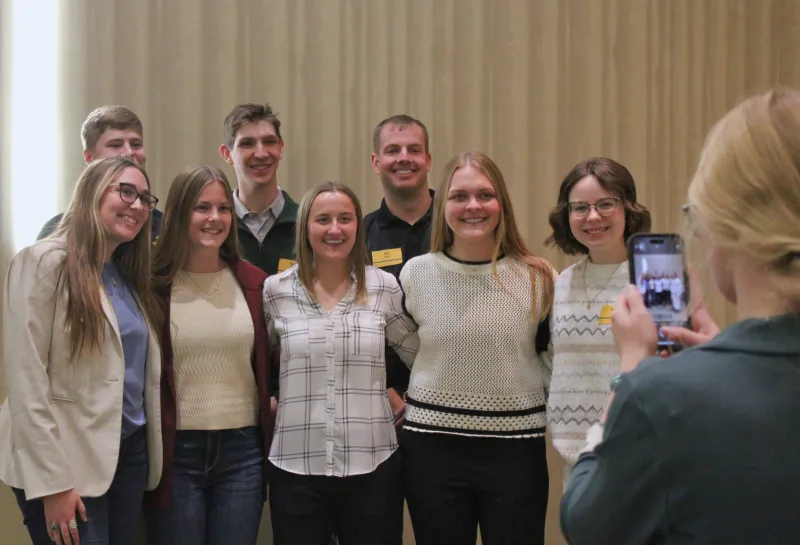 Group of scholarship recipients having photo taken