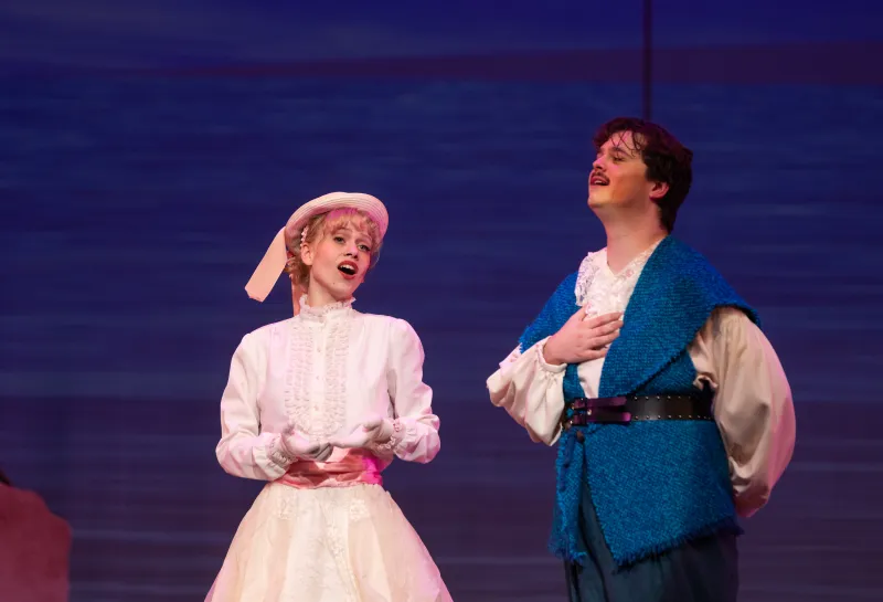 A female and male student performing in the NDSU Opera
