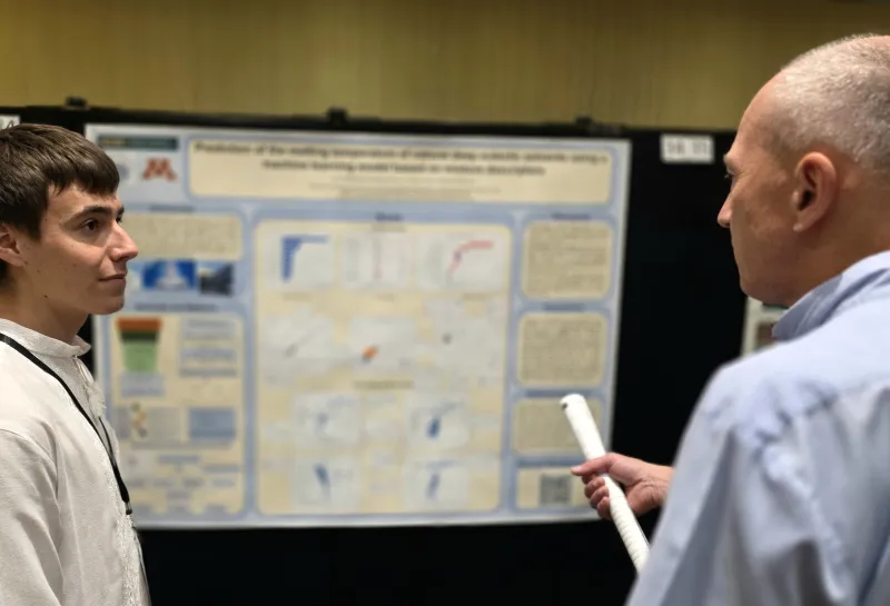 2026 summer REU students present their work at a poster session.