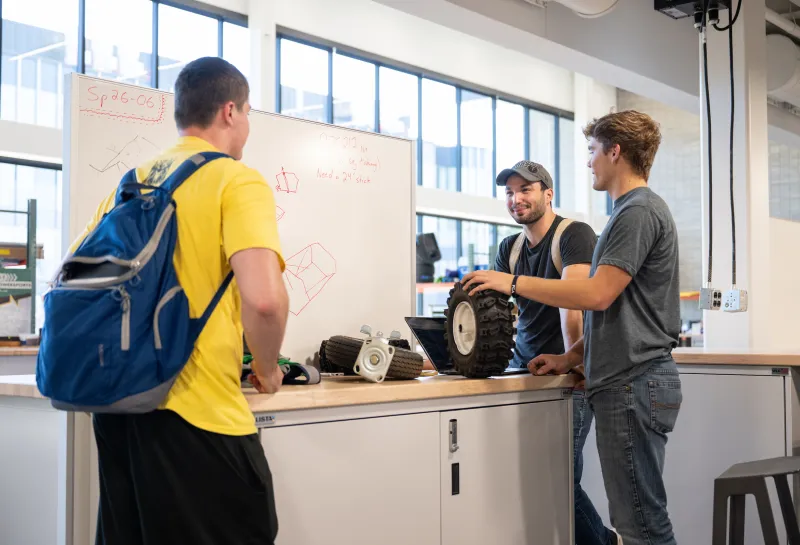 students working in bobcat shop