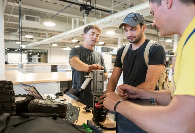 students working in bobcat shop