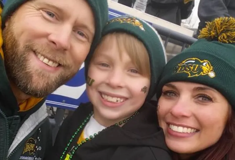 Rob Grosz, his son and Wife Amy