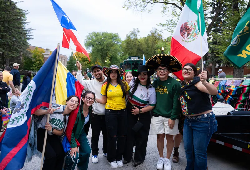 international NDSU student participate in the Homecoming parade