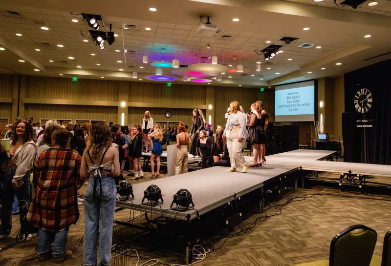 Models walking on runway.