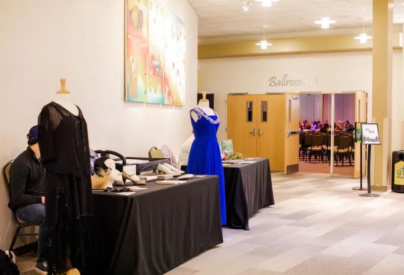 Dresses showcased in foyer of NDSU Ballroom.