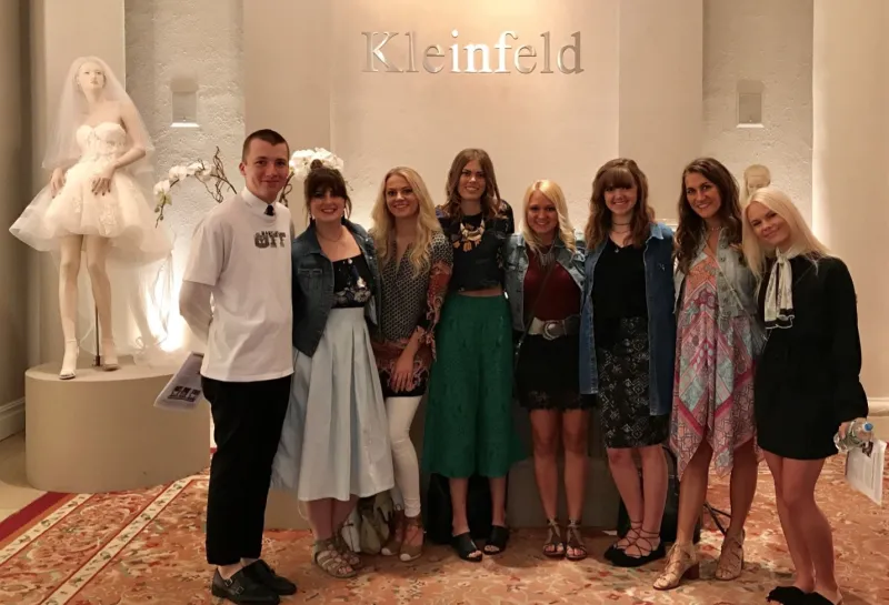 A group of students smiling at camera.