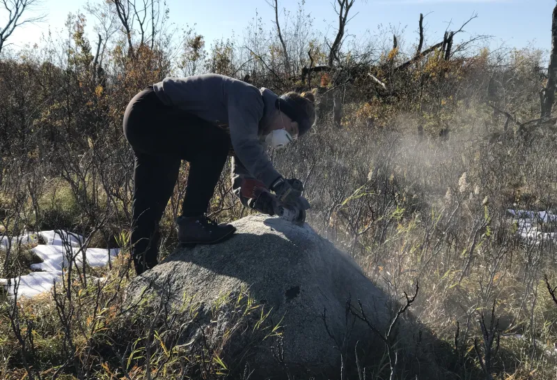 Student working in field.